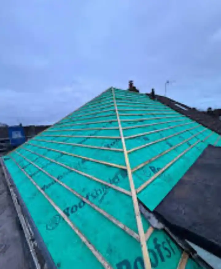 Green breathable membrane and new battens on a stripped roof