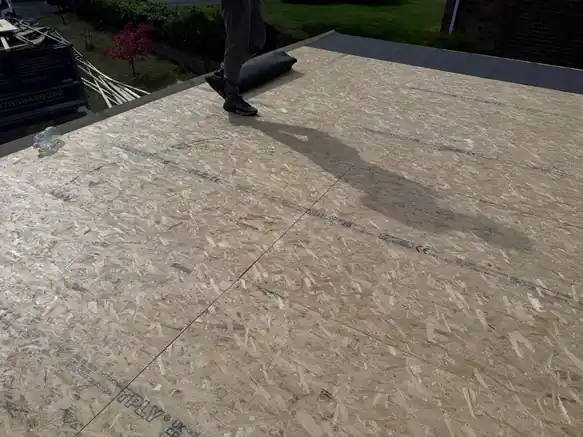 New OSB decking boards laid across a flat roof ready for the waterproof layer