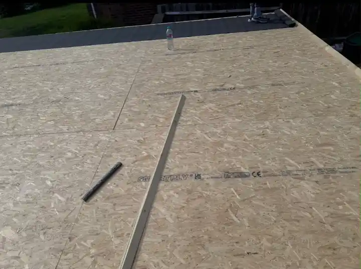 New OSB flat roof deck with edge trim ready to fit