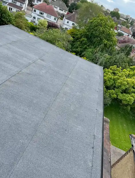 New grey mineral felt flat roof finished to a clean edge
