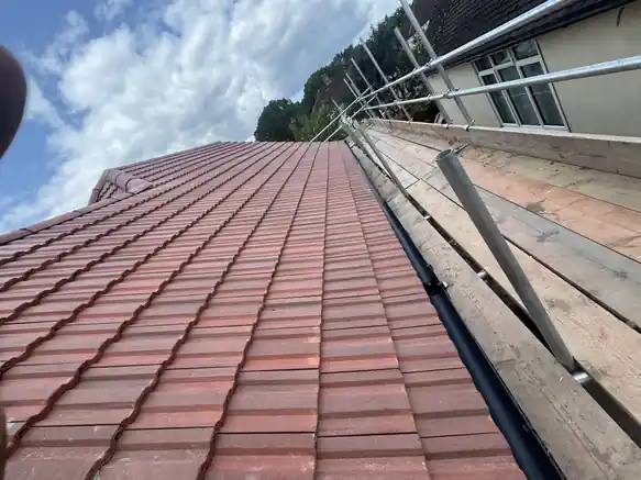 New red tile slope finished with dry verge