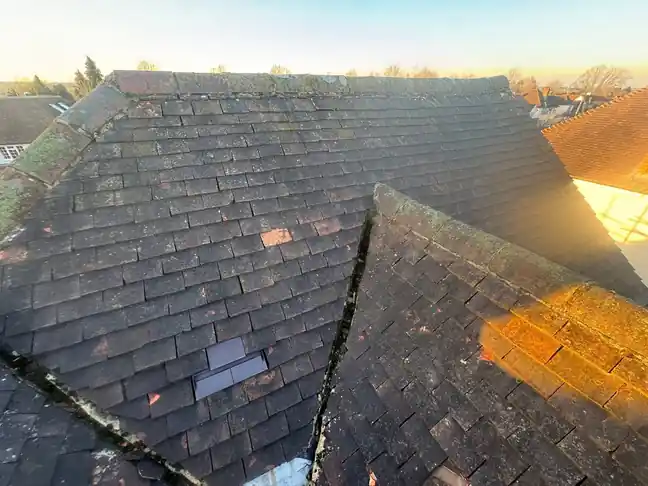 The old mossy plain tile roof in Farnham before it was stripped