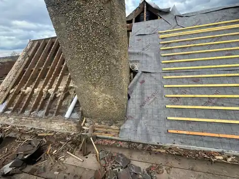 New membrane and battens going on round the chimney on the Farnham roof