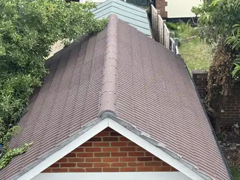 Garden outbuilding with a new tile roof