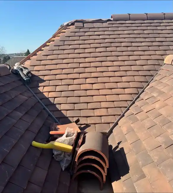 Ridge tile replacement on a clay tile roof