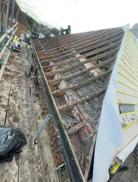 Roof stripped back to the rafters with new breathable membrane going on