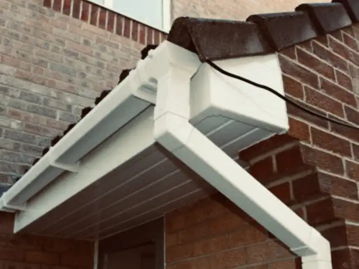 New white uPVC box end and soffit tucked under a concrete tile roof