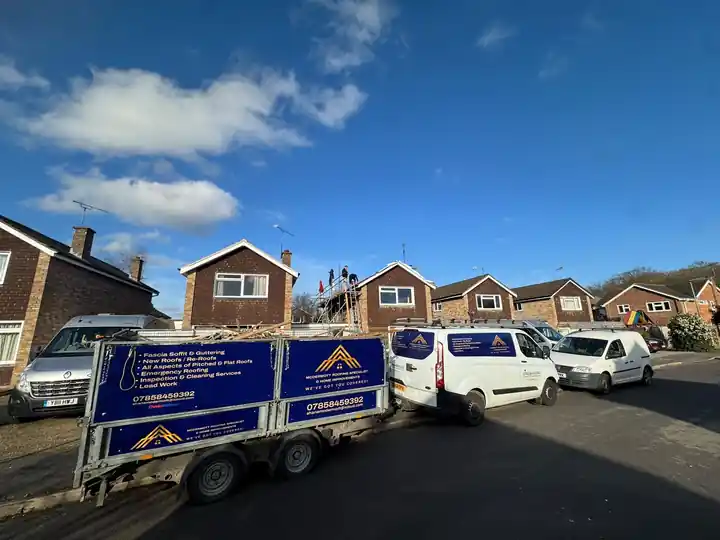 McDermott vans and trailer parked on a cul-de-sac job
